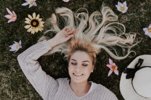 woman lying on flowers