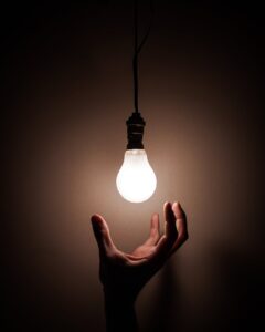 person holding white light bulb