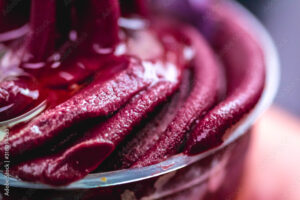 Açaí. Frozen acai with honey in a glass. This version of açaí is a more natural alteration of traditional açaí from the Amazon. Frozen açaí is often mixed with guaraná and banana syrup.