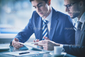 Businessmen discussing document