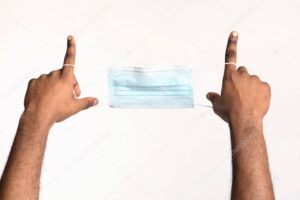 Cropped of black man holding face mask