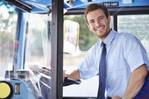 Portrait Of Bus Driver Behind Wheel