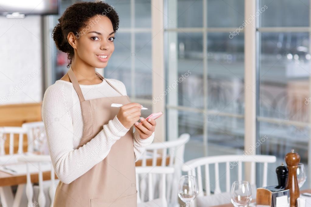 Waitress is ready to take order.