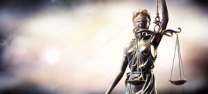 Statue Of Lady Justice On Blurred Background