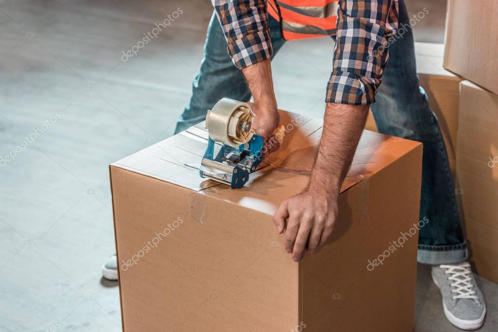 warehouse worker packing box