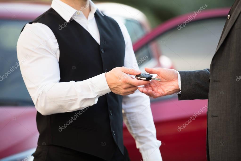 Valet Giving Car Key