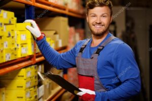 Worker on a automotive spare parts warehouse