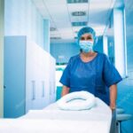 nurse pushing empty stretcher