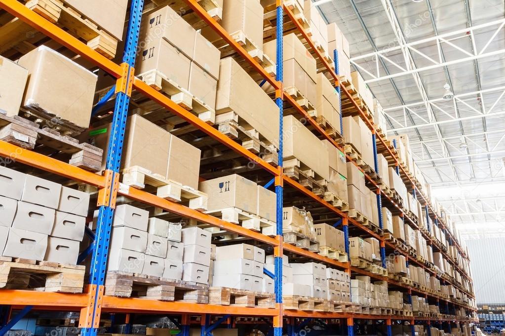 Rows of shelves with boxes in modern warehouse