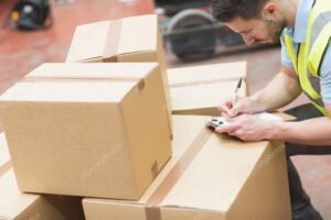 Warehouse worker with clipboard