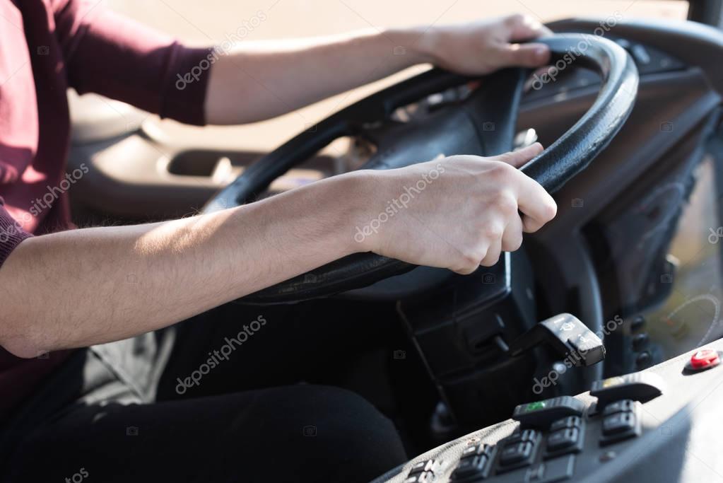 driver holding steering wheel