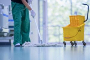 Clean and sanitize, Cleaner, Hospital cleaning,Cleaning the hospital floor. Floor care and cleaning services with washing mop in sterile factory or clean hospital.