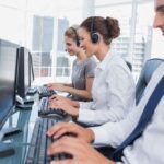 Group of call center agents working in line
