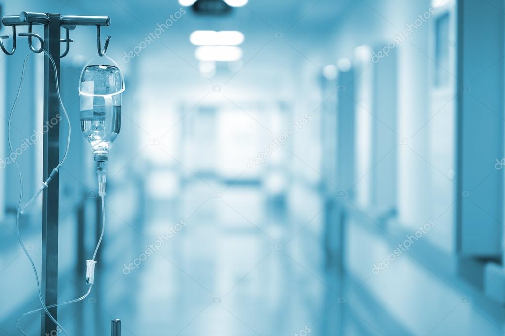 Iv drip on the background of blurred ward. Concept of serenity