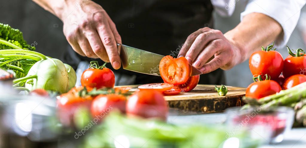 Chef cook preparing vegetables in his kitchen