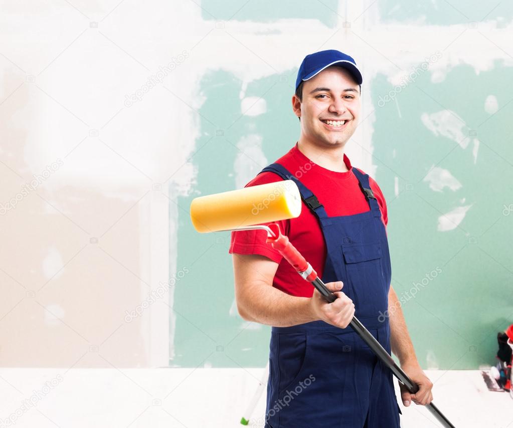 Friendly painter at work in an apartment